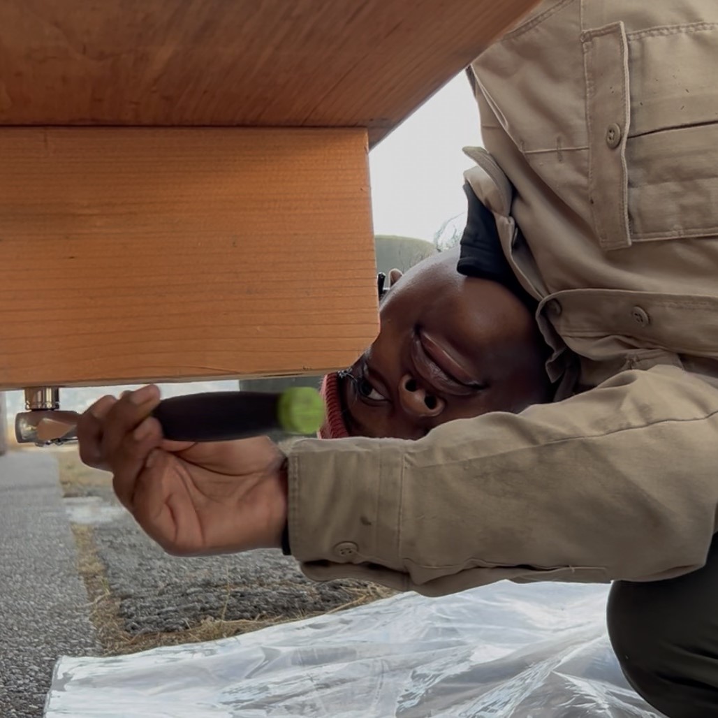 woman building picnic tables